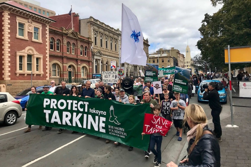 Bob Brown and Greens candidates lead the Save the Tarkine marchers through Hobart, Sunday February 25, 2018.