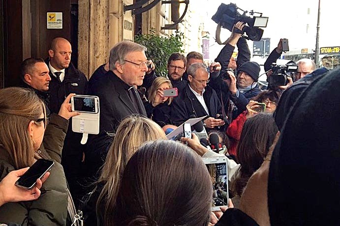Cardinal George Pell leaves a meeting with sex abuse survivors in Rome