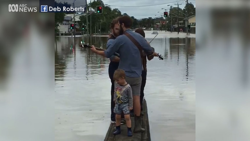 Music plays as floodwaters recede