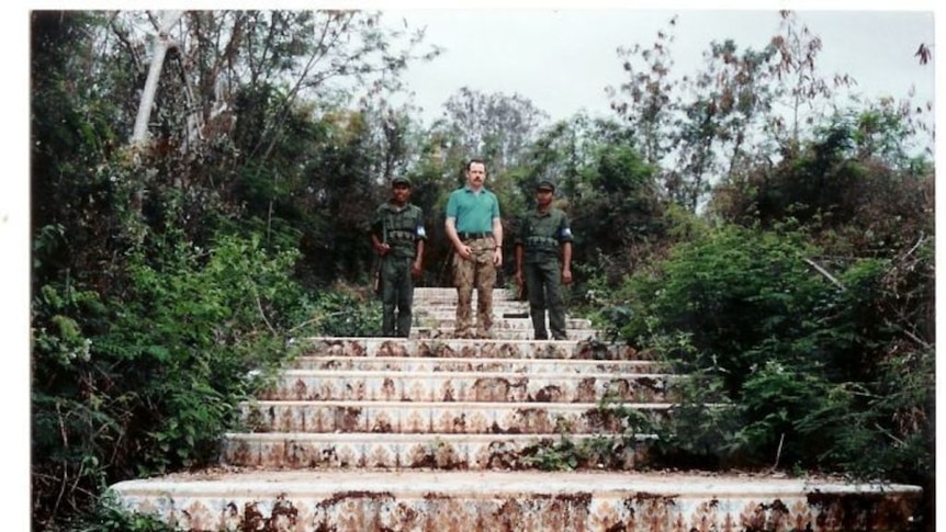 Mick Quinn with two Khmer Rouge guards during his deployment as a peacekeeper in Cambodia.