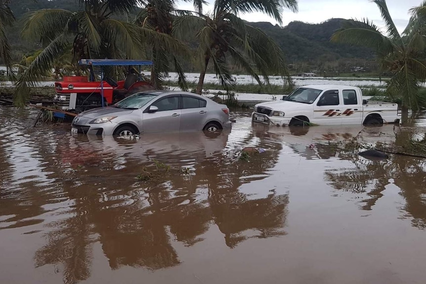 Two cars stuck in flood waters