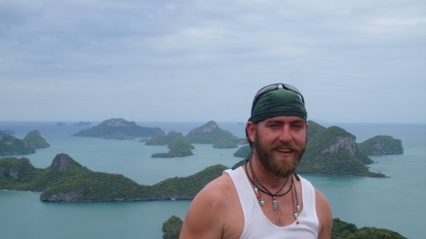 Omega Ruston stand in the foreground with islands in the background at an unknown location.