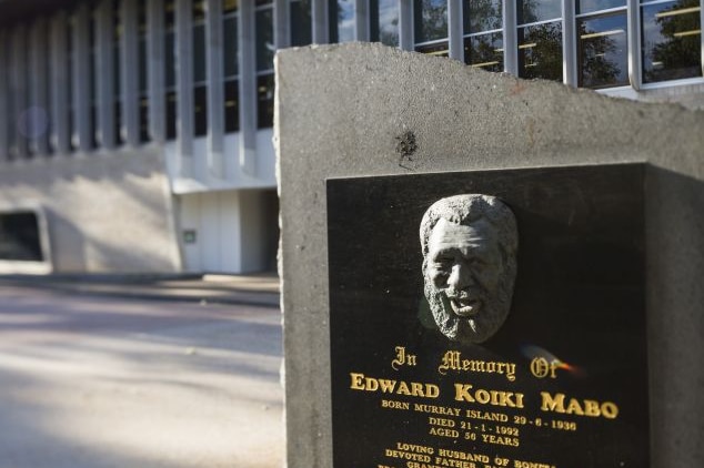 A plaque at James Cook University featuring the face of Eddie Koiki Mabo