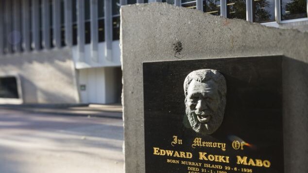 A plaque at James Cook University featuring the face of Eddie Koiki Mabo