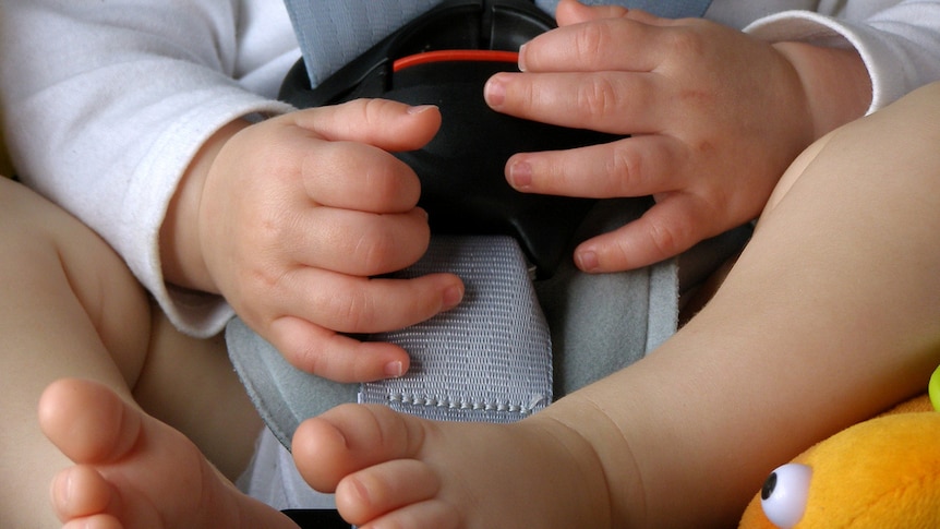 Baby in a car seat.