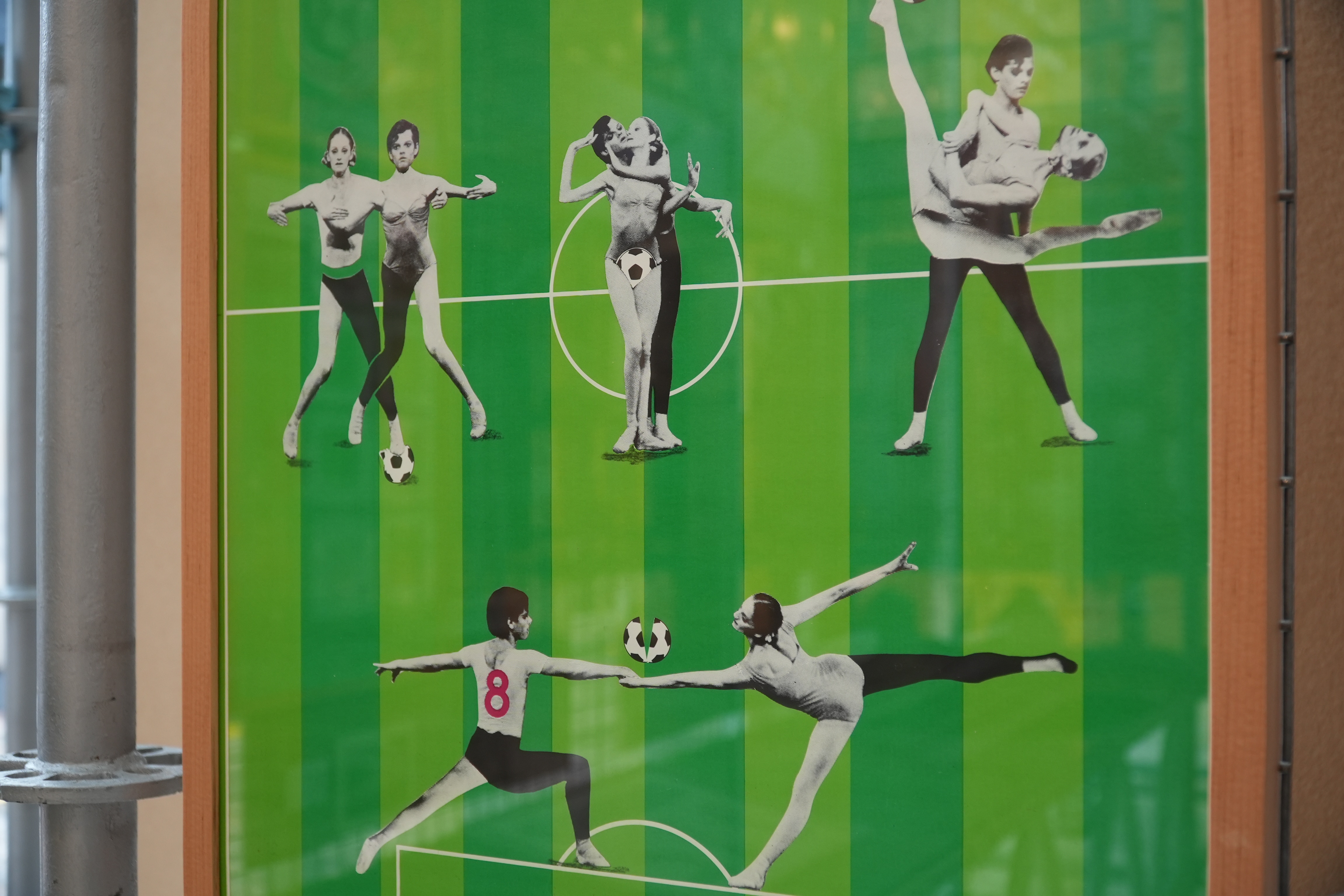 Images of black and white ballet dancers superimposed onto a football pitch.