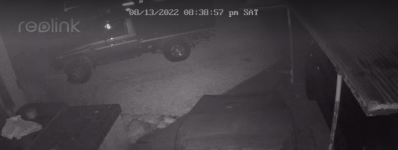 Car headlights shine in the dark street