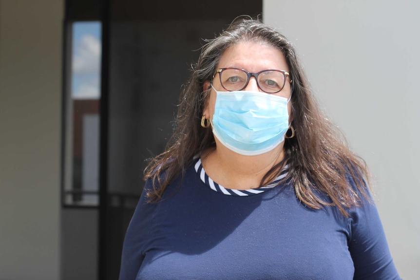 pic of woman wearing blue face masks at flat