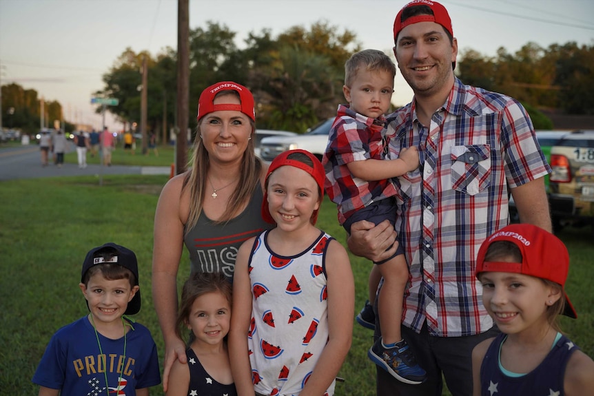 A mum and dad with five children outside the Trump rally