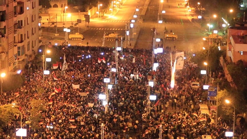 Protesters against Egypt's president Mohamed Morsi let off fireworks