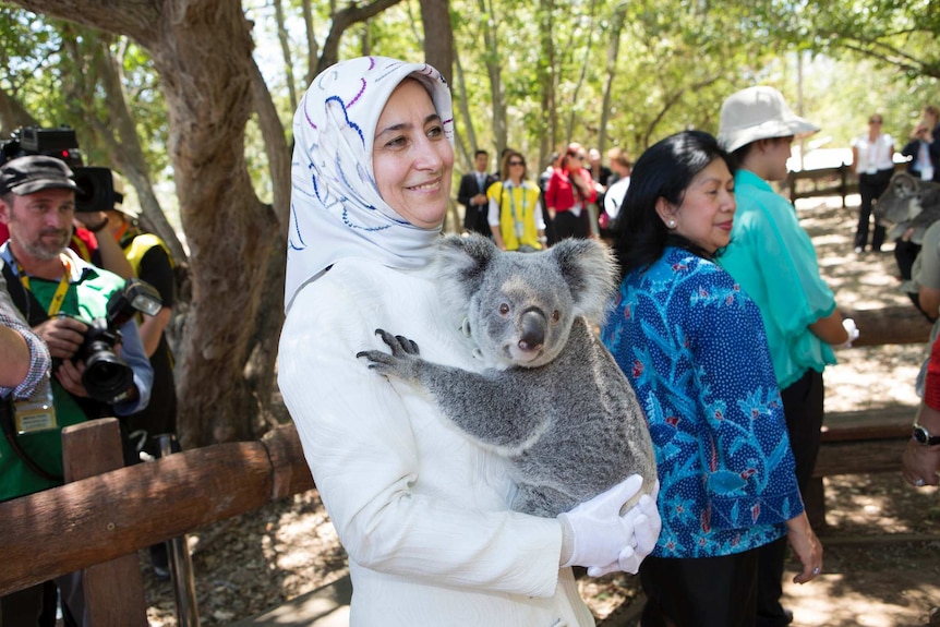 Sare Davutoglu of Turkey cuddles a koala