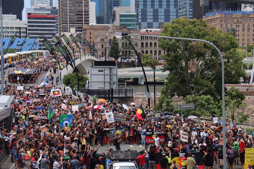 Invasion Day march in Brisbane reaches the city's Victoria Bridge on January 26, 2017