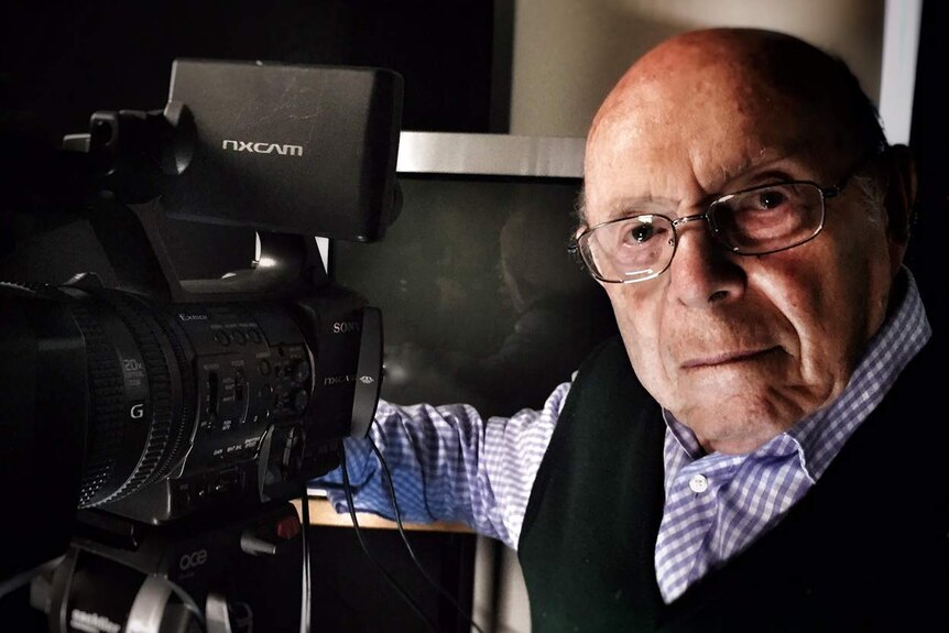Phillip Maisel with his camera, which uses to record the testimony of Holocaust survivors.