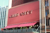 The red Hoyts Mid City building has shops on street level, a balcony on the second level and a handful of other levels.