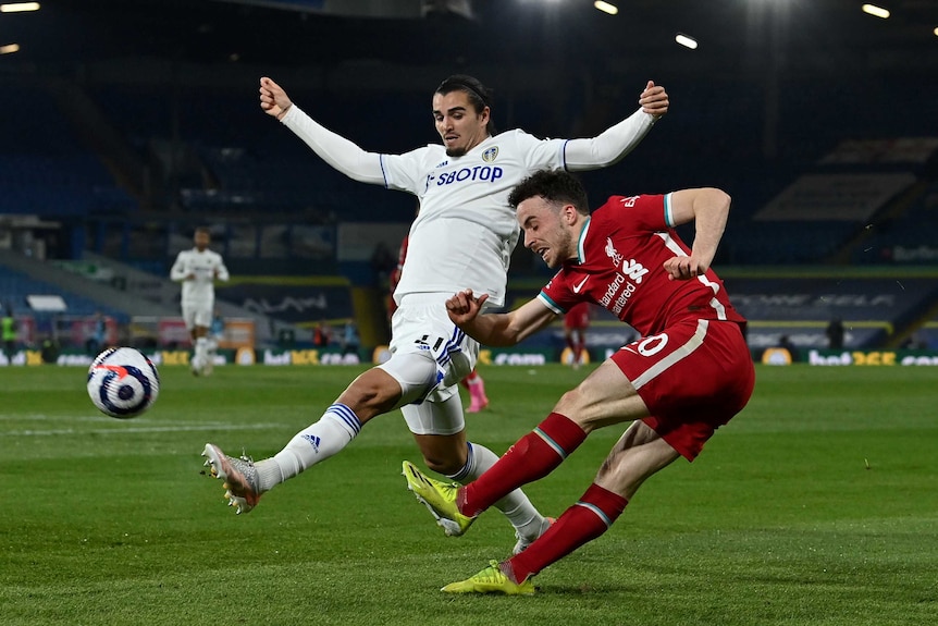 Diogo Jota of Liverpool is challenged by Pascal Struijk of Leeds United during the Premier League match