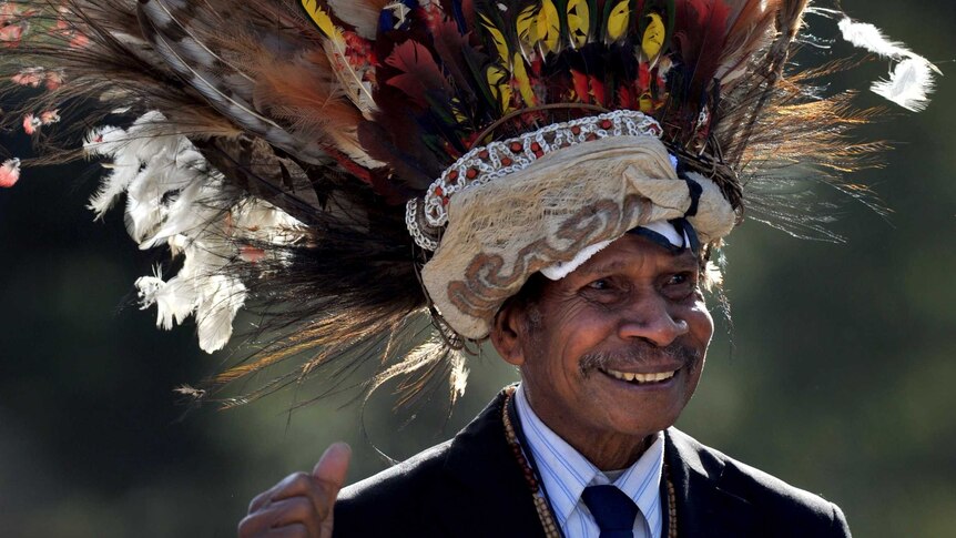 Simbeon Baker from PNG marches during the Anzac Day Parade in Melbourne