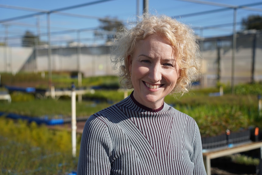 Lee Broomhall stands in front of Workpower garden beds.