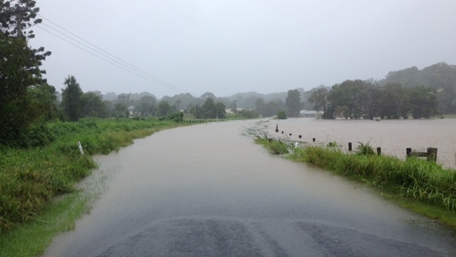 Floodwaters cover a road at Billinudgel in northern NSW on Friday February 20, 2015