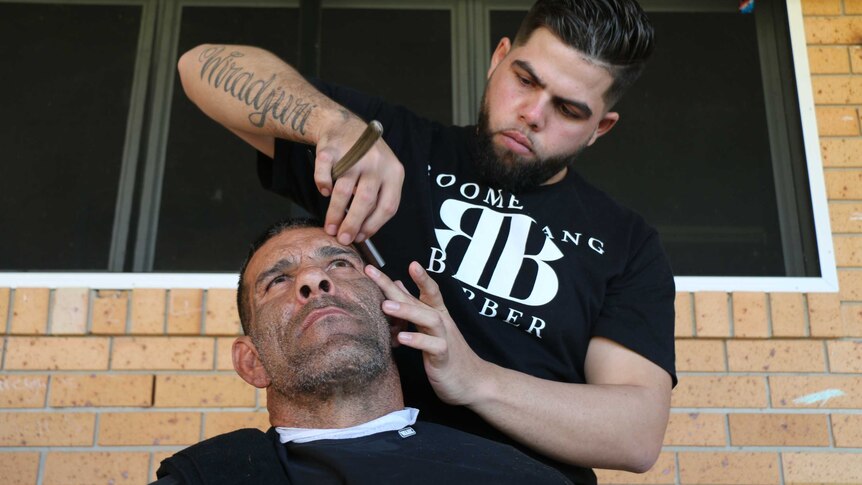 Barber Cory Sutherland makes a close shave.