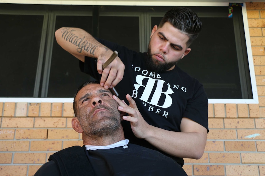 Barber Cory Sutherland makes a close shave.
