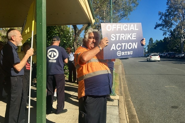 Driver Philip Miles takes to the street to protest outside the Toowong Bus Depot. 
