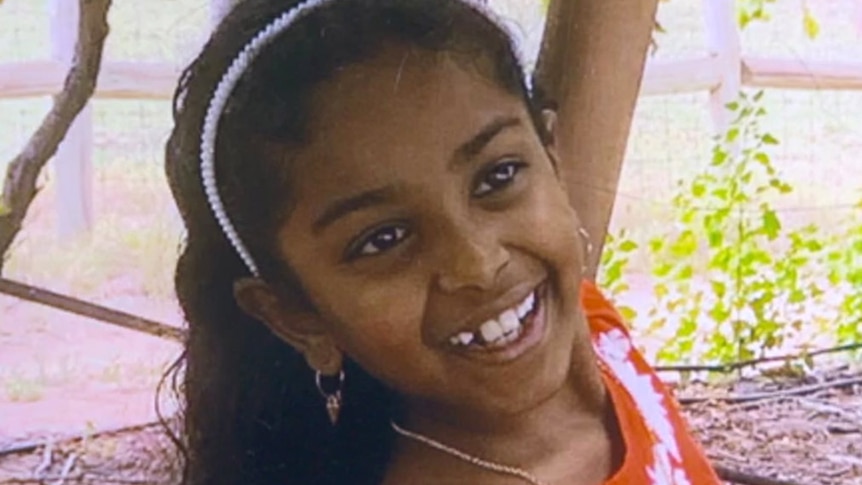 A smiling young girl in headshot