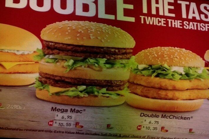 A McDonald's menu board showing a Big Mac and a Double McChicken.