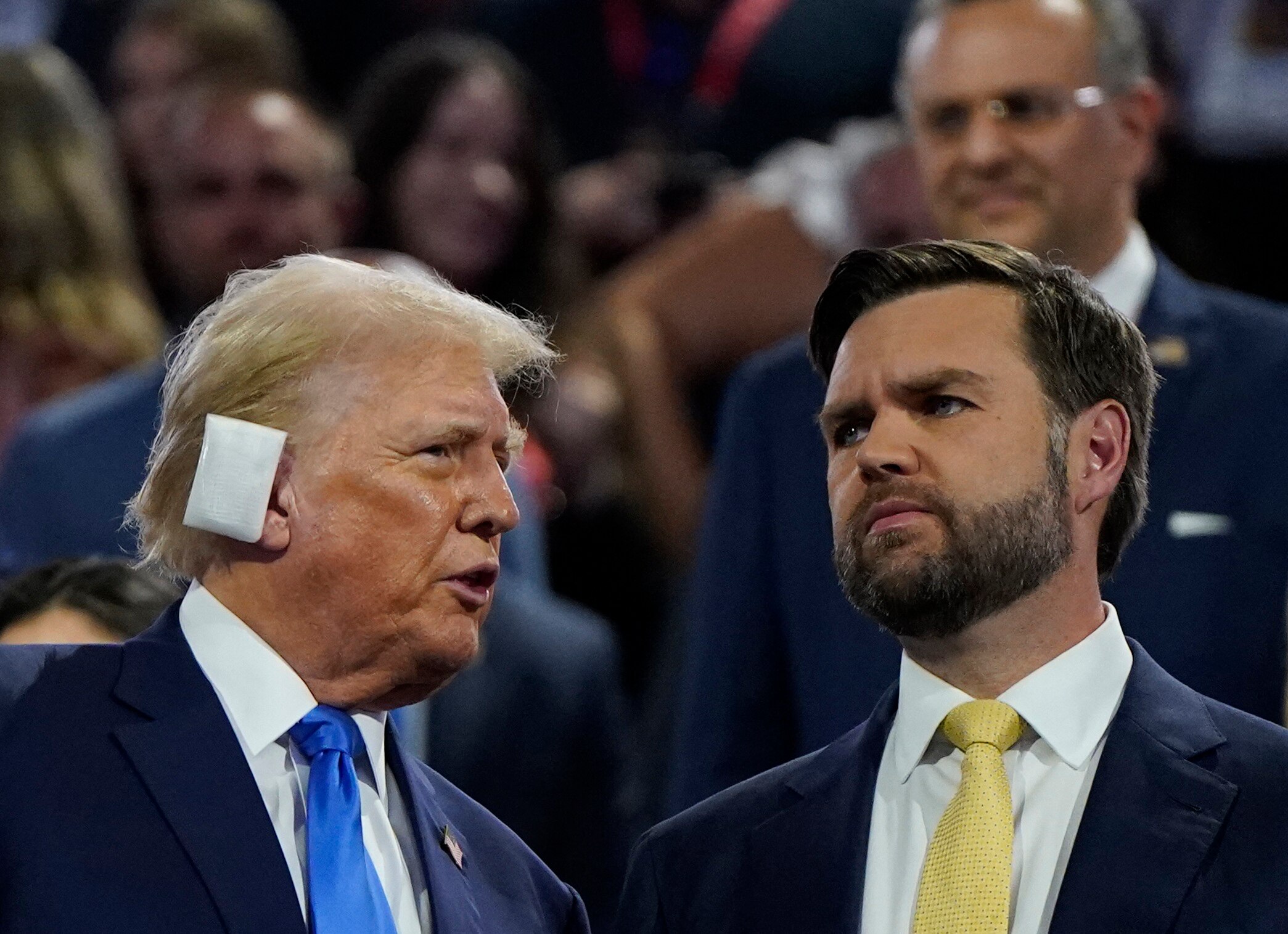 Trump, with a bandaged ear, speaks to JD Vance