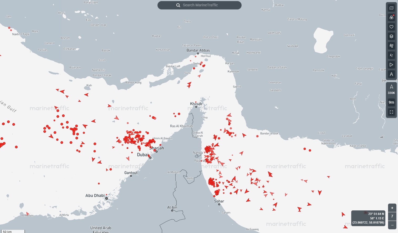 A greyscale map showing hundreds of red ship markers in the Strait of Hormuz, Persian Gulf and Gulf of Oman.