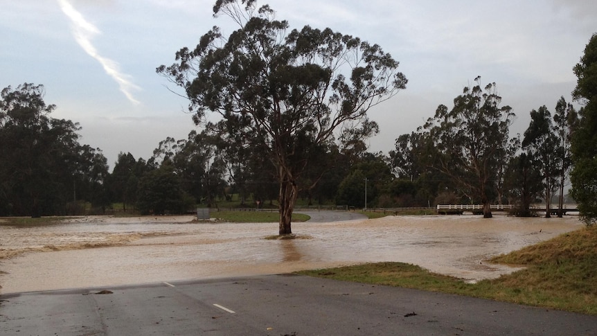 Floodwaters cover a road at Yinnar.