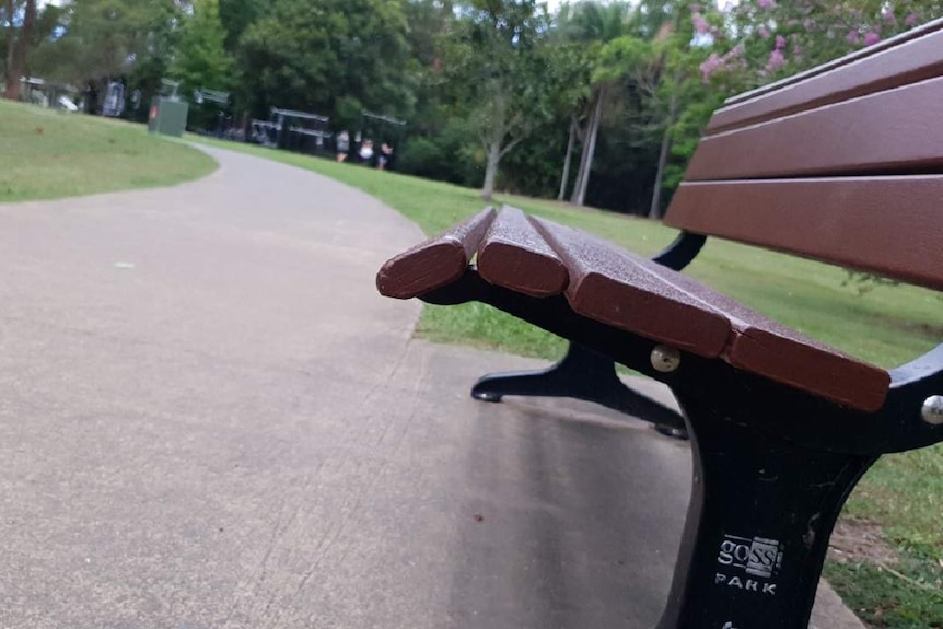 A park bench in a park.