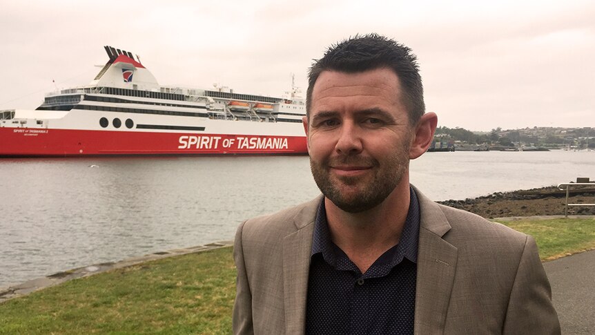 Daryl Connelly in front of the Spirit of Tasmania