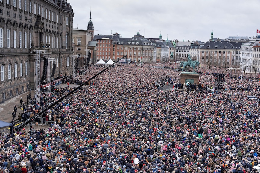 A huge crowd in a European square