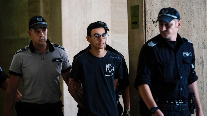 Mourad Hamyd, 20 years old, (C) escorted by police officers arriving at court in Sofia, Bulgaria.