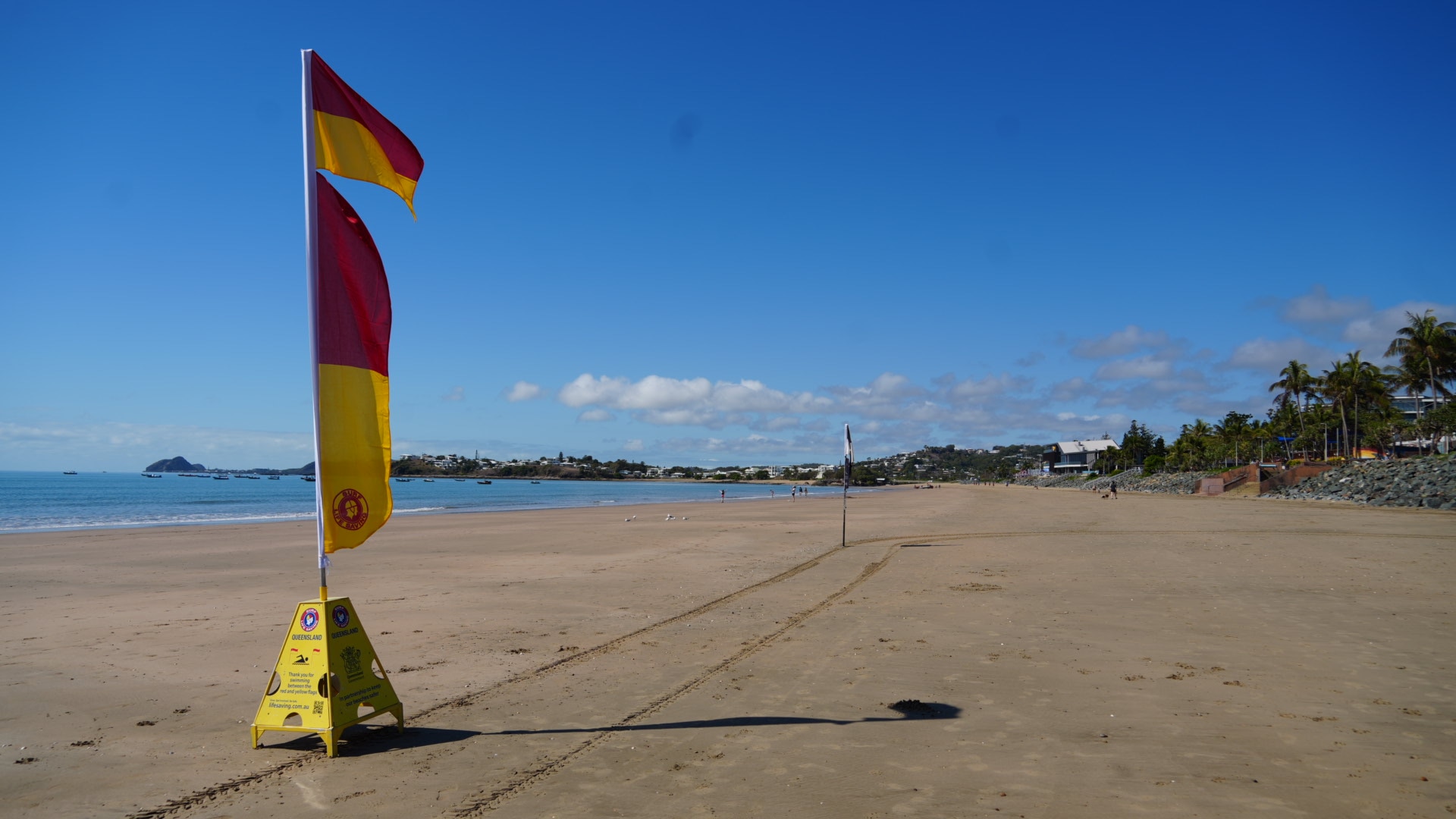 Red and yellow Surf Life Saving flags on Yeppoon Main Beach.