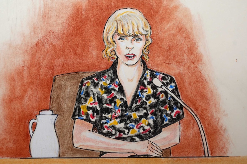 A court sketch of Taylor Swift. She is shown sitting at a witness stand, wearing a black top with spots of primary colours.