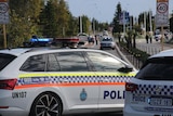 A police car and a footpath. 