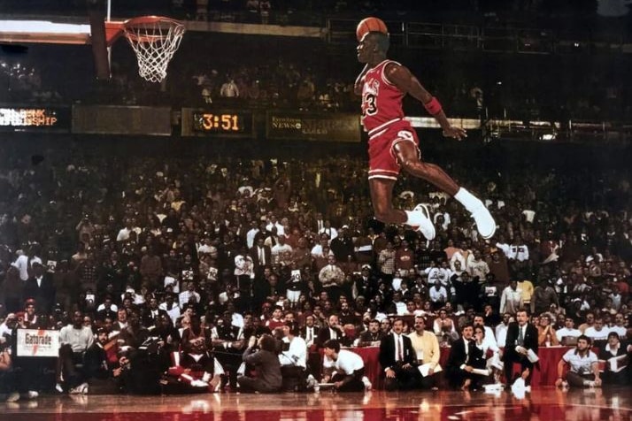 A photo of Michael Jordan about to slam dunk.