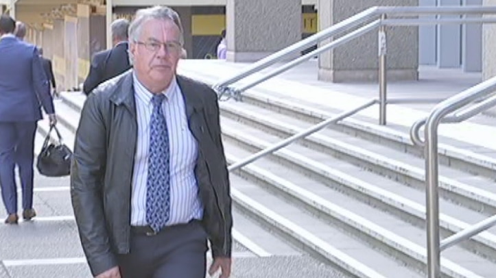 Wayne Parker walking in front of court