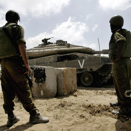 Israeli tanks wait to cross into the northern Gaza Strip