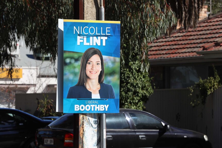 A poster stuck on a power pole for Nicolle Flint that doesn't include Liberal Party branding