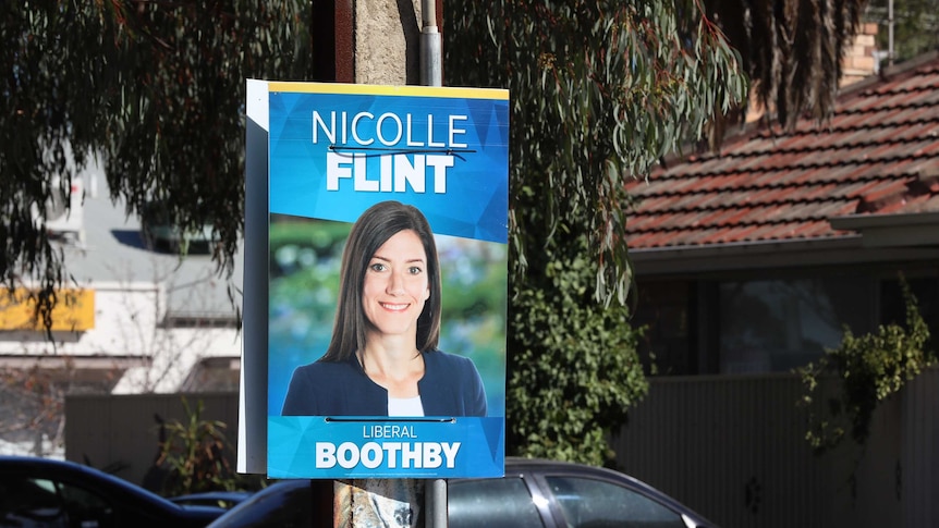 A poster stuck on a power pole for Nicolle Flint that doesn't include Liberal Party branding