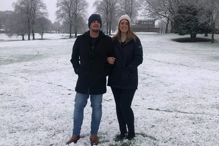 Louise Faint stands with her boyfiend Alex in the snow.