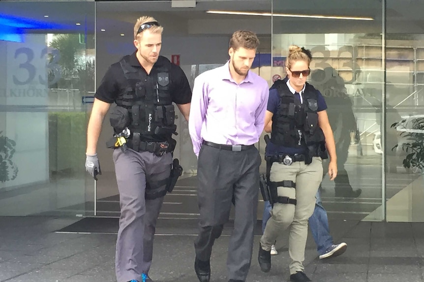 Daniel East, 32, arrested by police at his Surfers Paradise call centre on Monday.