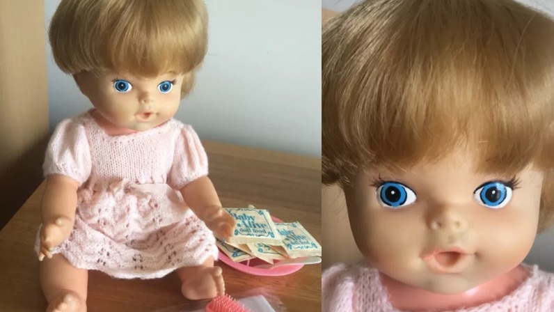 A vintage Baby Alive doll and box