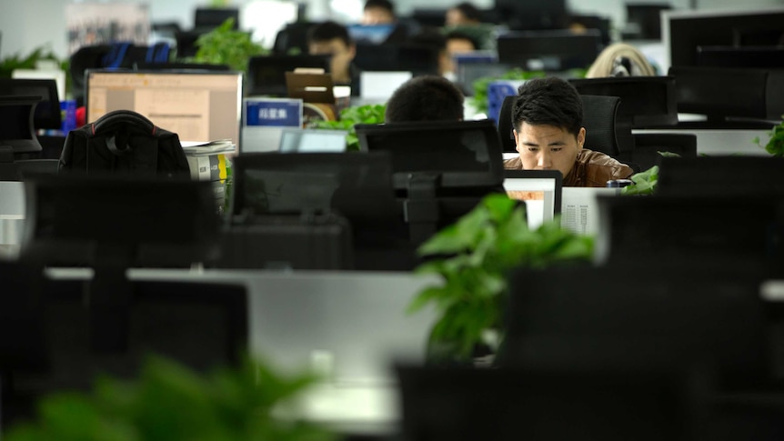 A Watrix employee works at his desk in their company's offices in Beijing.
