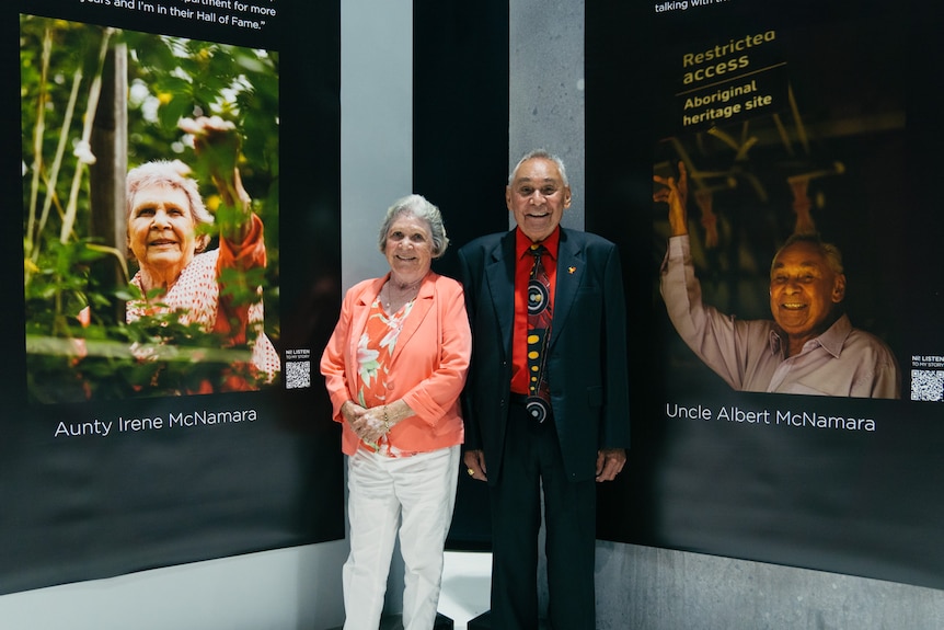 Aunty Irene and Uncle Albert McNamara, with their portraits that appear in the book.