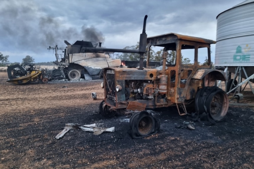 Burned tractor and field bin