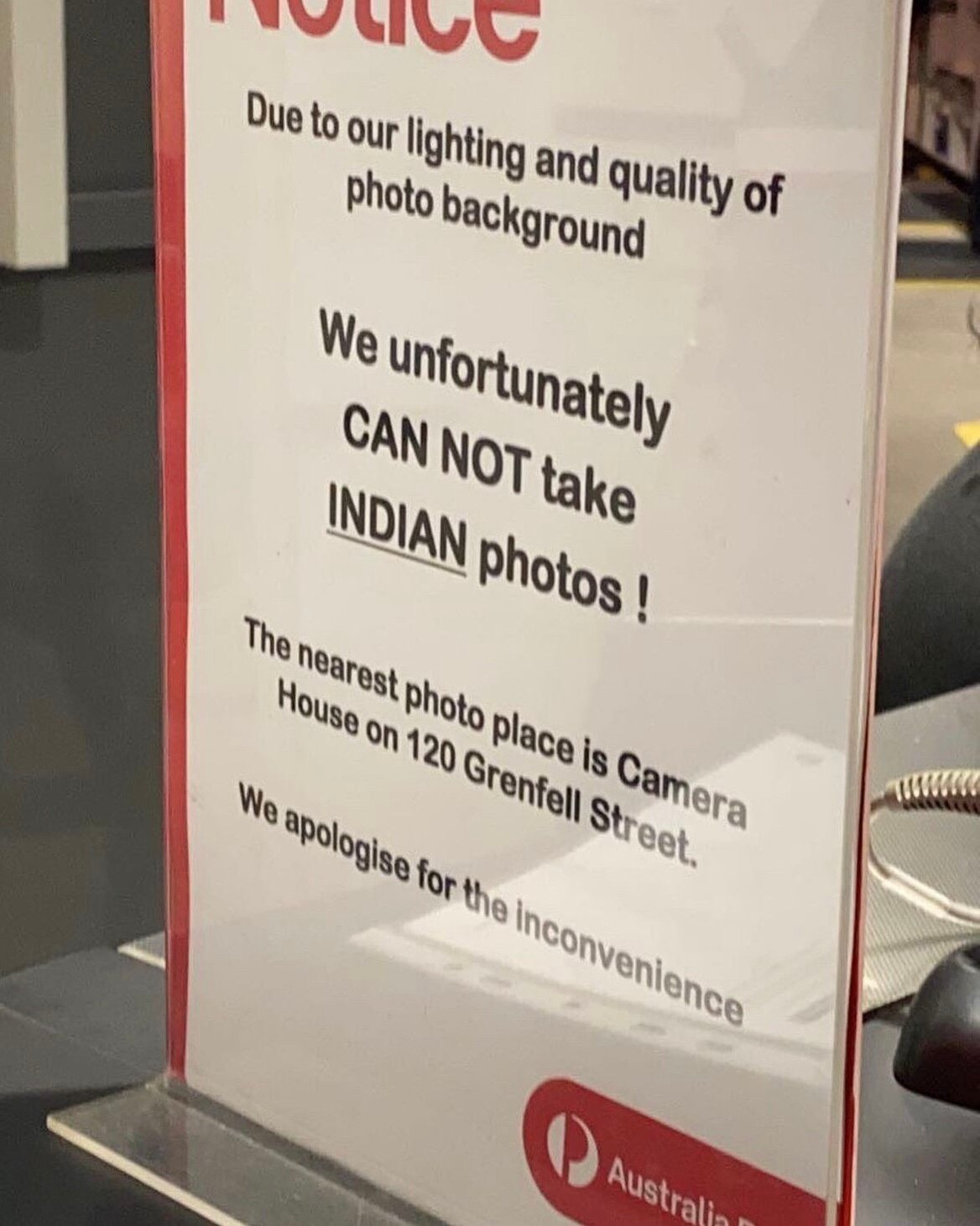 Australia Post apologises for 'inexcusable' sign in Adelaide post office