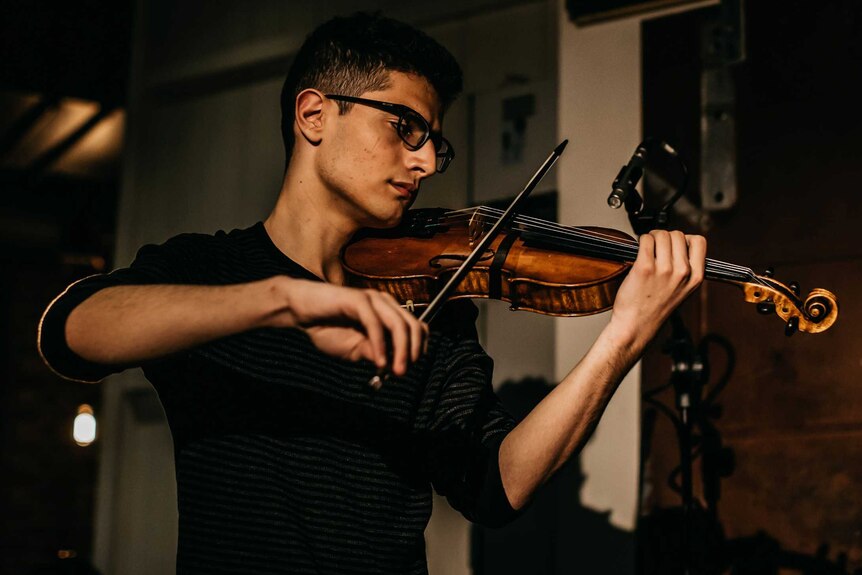 Aboud Kaplo playing his violin